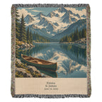 Mountain Lake personalized woven cotton blanket shown full front: snowy peaks, pines and a green canoe on a mirrored lake, with the woven names and date on the cream panel.