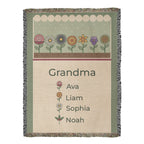 Personalized grandma woven cotton blanket, full front with a row of birth flowers, Grandma above Ava, Liam, Sophia and Noah with flowers