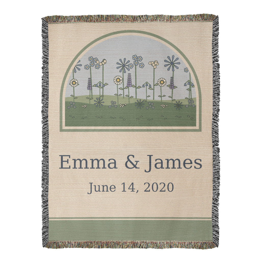 Personalized anniversary woven cotton blanket, full front: arched wildflower meadow above Emma & James and the wedding date June 14, 2020