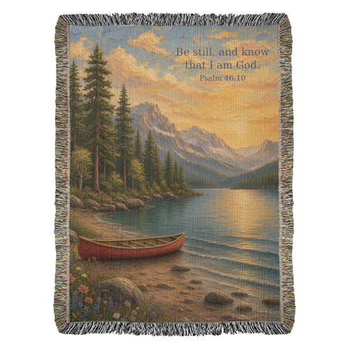 Be Still lake woven throw, full front flat on white with fringe: red canoe on a mountain lake with Psalm 46:10