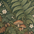 Macro close-up of the Woodland Garden woven cotton blanket showing the tight cotton weave across the green fern fronds, cream wildflowers and brown woodland mushrooms.
