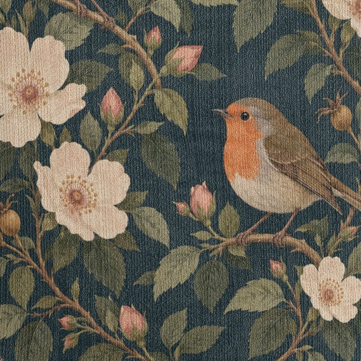 Macro close-up of the Bird Garden woven cotton blanket showing the tight cotton weave across the robin perched among cream roses, buds and leafy branches on a deep navy ground.