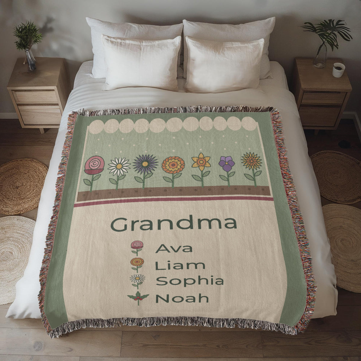 Personalized grandma birth flower woven blanket spread on a bed, sage and cream design with grandkids names and fringe