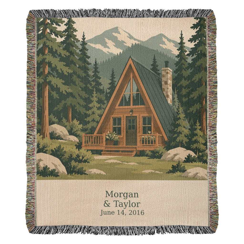 Cabin personalized woven cotton blanket shown full front on a plain background, with the woven names and date on the lettering panel.