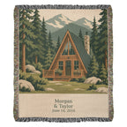 Cabin personalized woven cotton blanket shown full front on a plain background, with the woven names and date on the lettering panel.