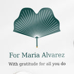 Close-up of the printed text on the clear acrylic puzzle-piece caregiver plaque reading "For Maria Alvarez" and "With gratitude for all you do"