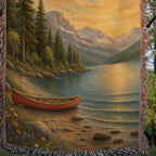 Detail of the Be Still lake woven throw hung on a clothesline in the trees: canoe, lake and fringe