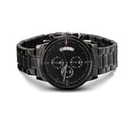 Front view of a black chronograph watch with a black metal bracelet on a white background