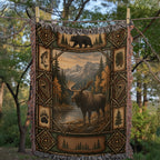 Wildlife lodge woven blanket hanging outdoors among trees, full front with the moose scene, bear panel and pine tree line