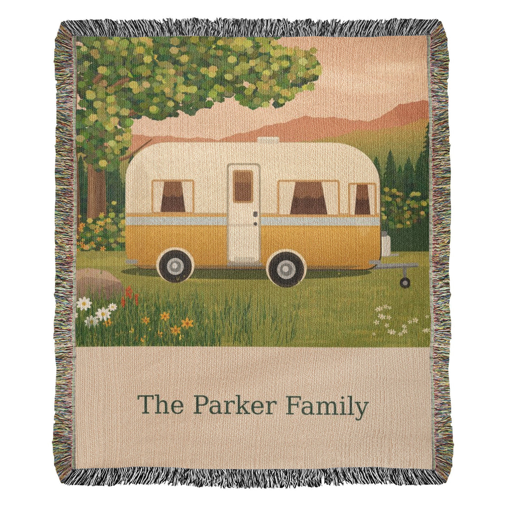 Family Caravan personalized woven cotton blanket shown full front on a plain background, with the woven names and date on the lettering panel.