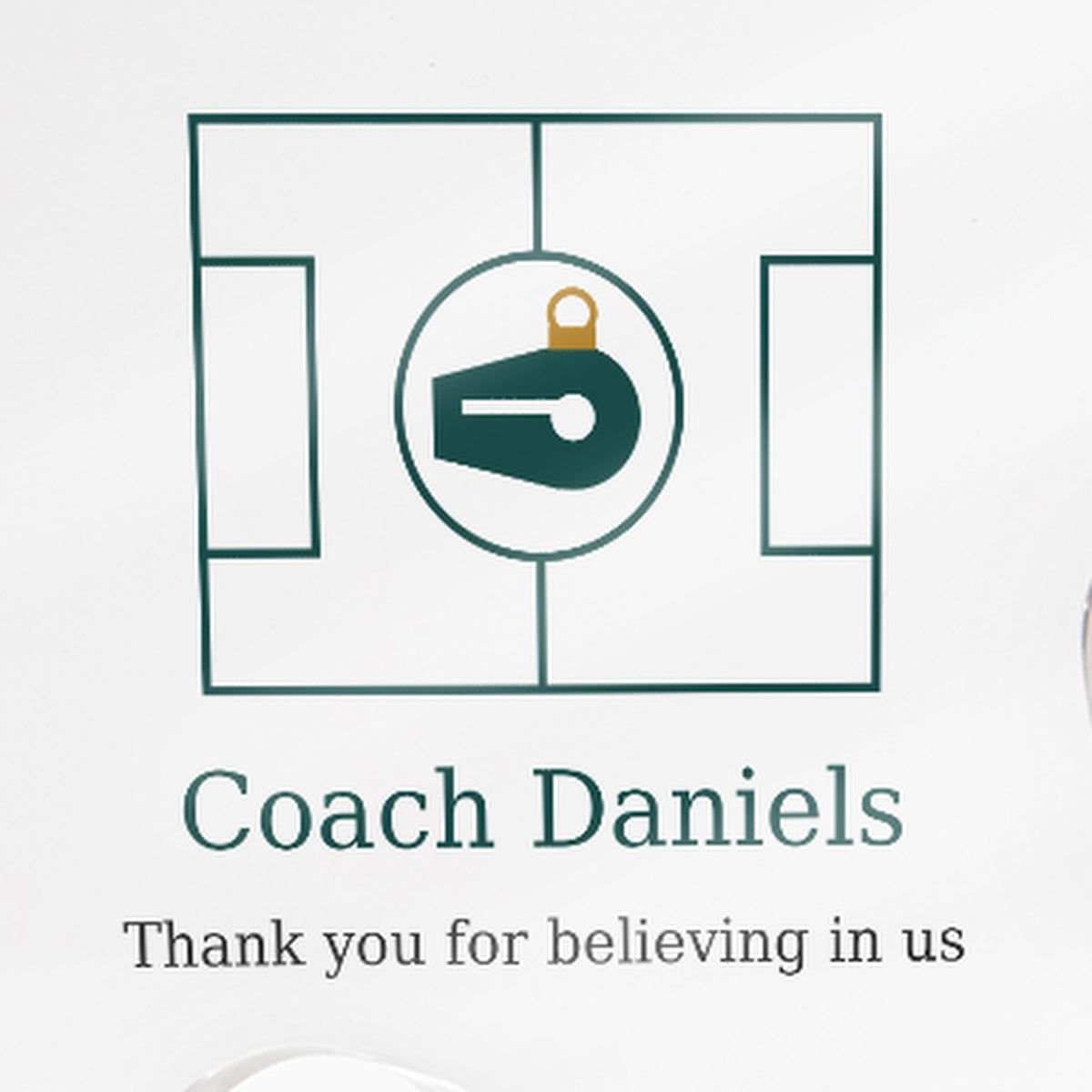 Close-up of the printed text on the clear acrylic puzzle-piece coach plaque reading "Coach Daniels" and "Thank you for believing in us"