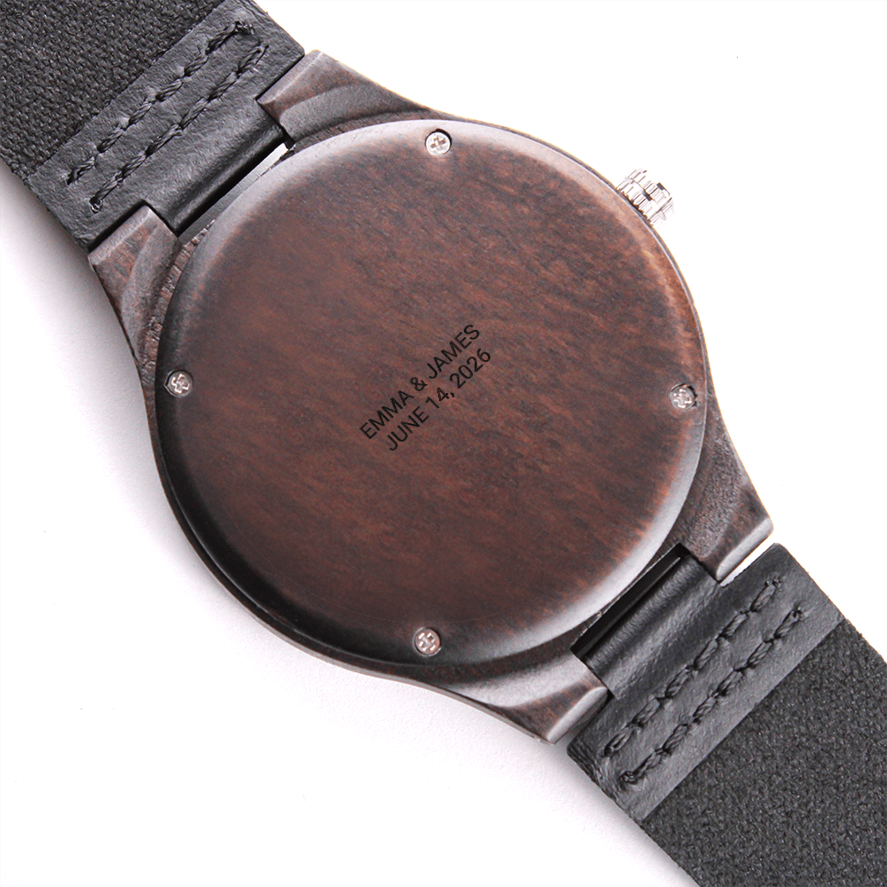 Wooden watch caseback with a two-line wedding engraving in capital letters