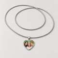 Steel heart photo necklace with a family photo of three smiling women on the pendant and a full snake chain