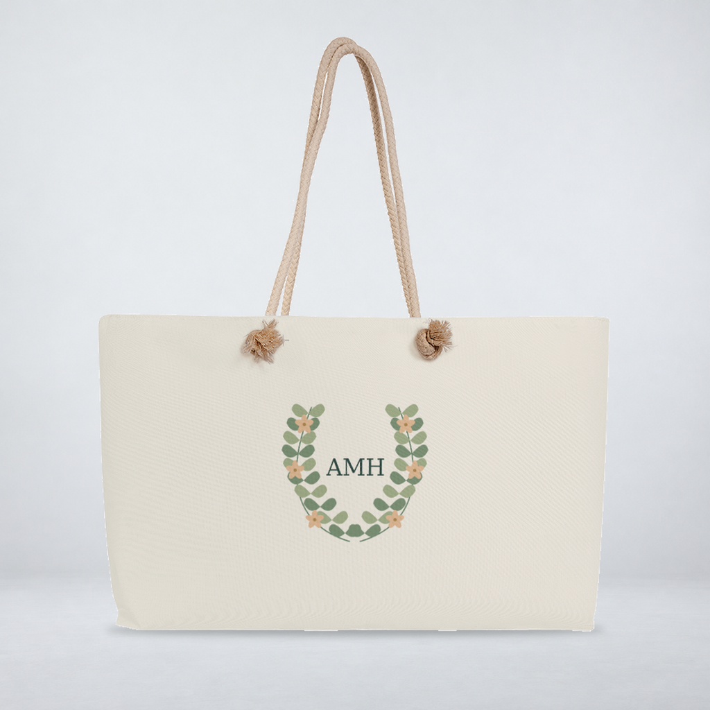 Botanical monogram weekender with cream rope handles and comfortably spaced AMH initials.
