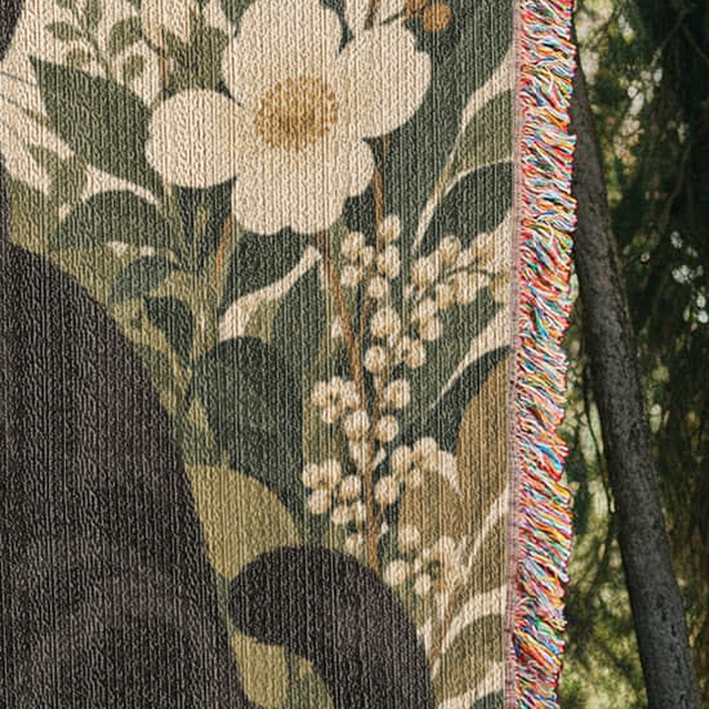 Black Cat Botanical hanging blanket showing the cotton fabric and side fringe