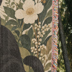 Black Cat Botanical hanging blanket showing the cotton fabric and side fringe