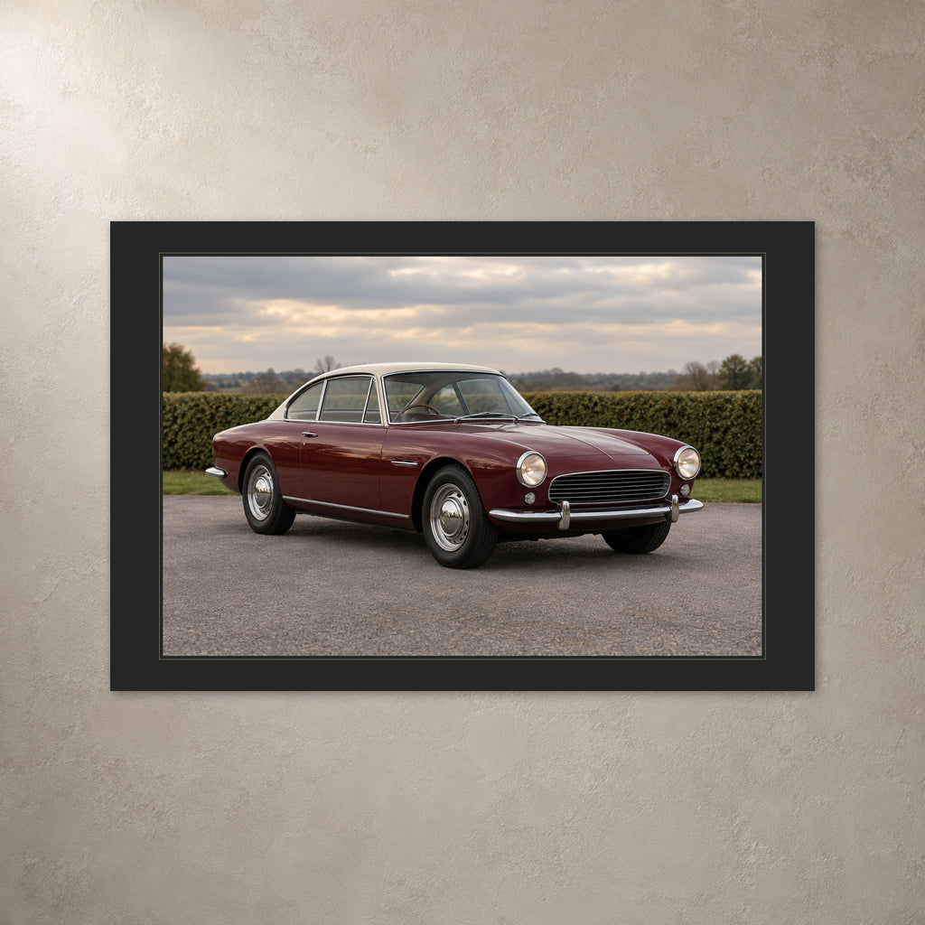 Classic car photo canvas with a charcoal printed border, shown from the front on a light plaster wall.