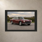 Classic car photo canvas with a charcoal printed border, shown from the front on a light plaster wall.