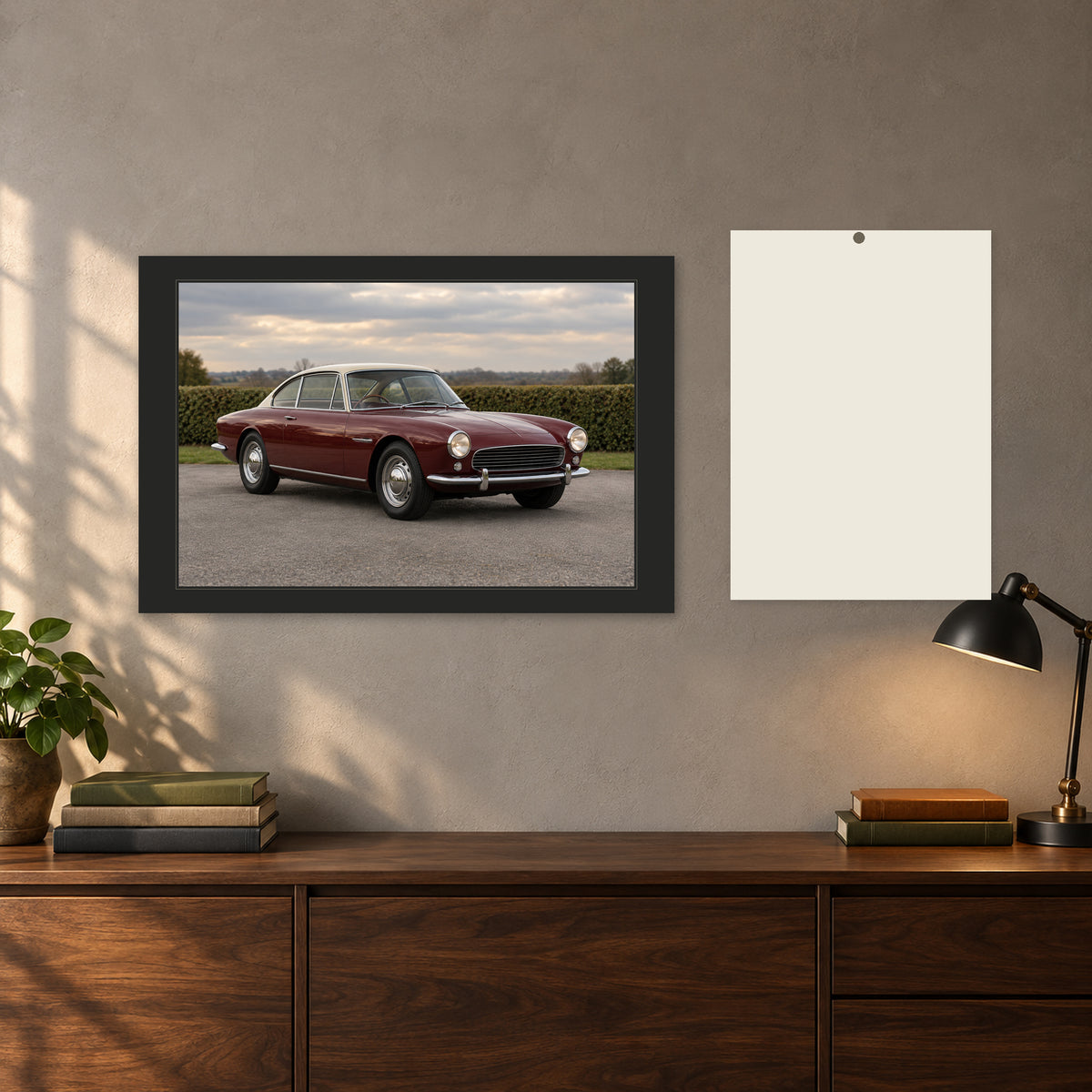 Classic car photo canvas above a walnut cabinet, beside an A5 paper note for scale.