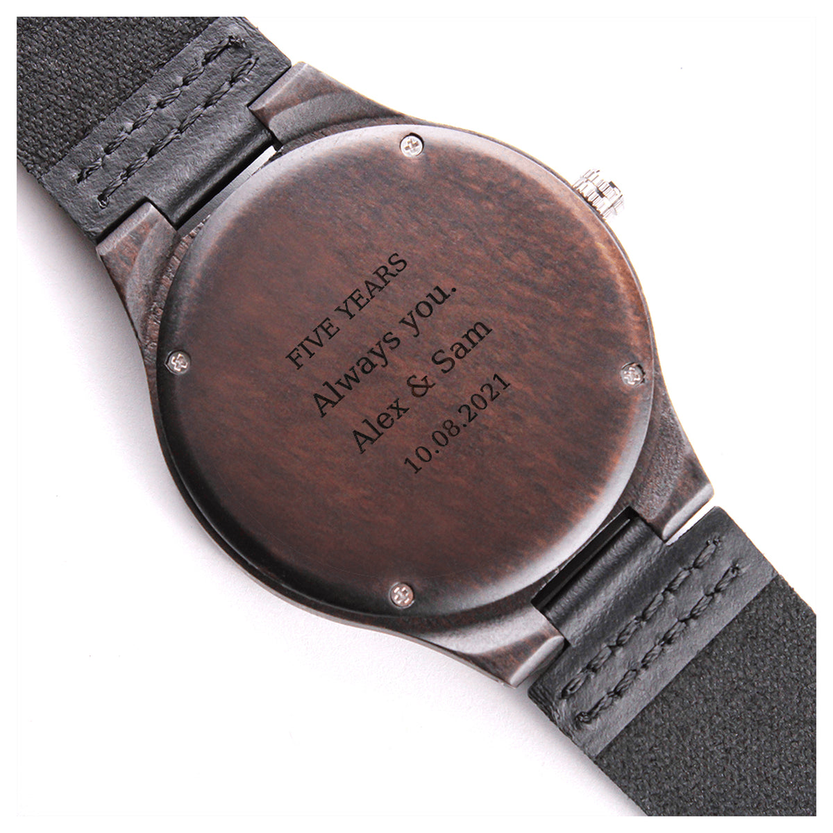 Close-up of the anniversary engraving on the wooden watch caseback