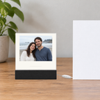 Anniversary photo plaque on a wooden desk with LED base and controller