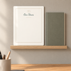 Unfilled 8 by 10 inch vows print displayed on a shelf.