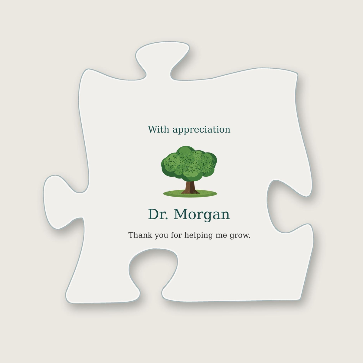 Clear acrylic puzzle-piece plaque with the heading "With appreciation", a small green oak tree illustration, the name "Dr. Morgan" and the message "Thank you for helping me grow."