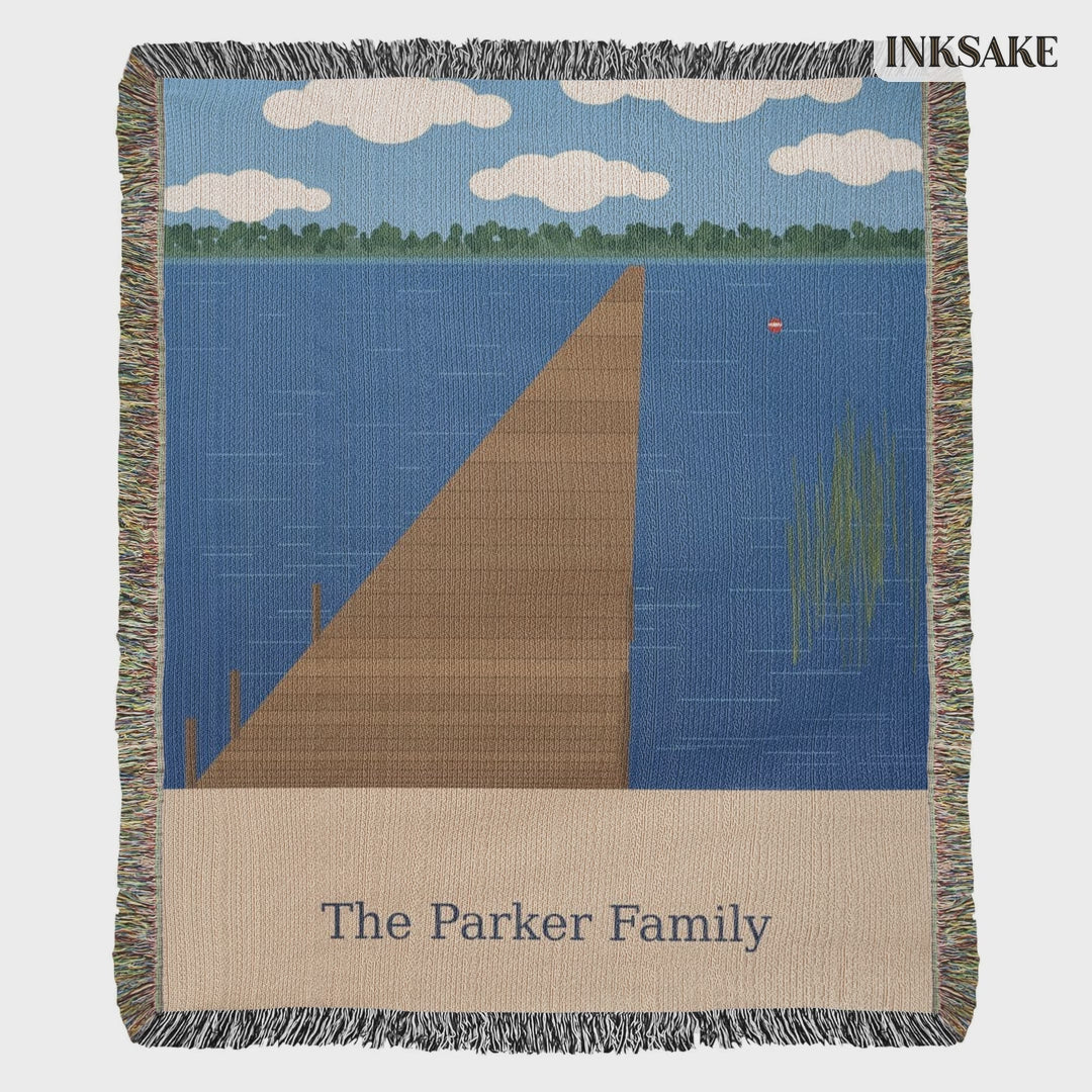 Personalized lake dock woven blanket with The Parker Family lettering, shown full length and laid on the floor