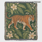 Tiger Botanical woven cotton blanket with a striding tiger among tropical leaves and blooms