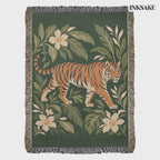Tiger Botanical woven cotton blanket video: the full front on white, then hung on an outdoor line among trees with a slow zoom on the striding tiger.