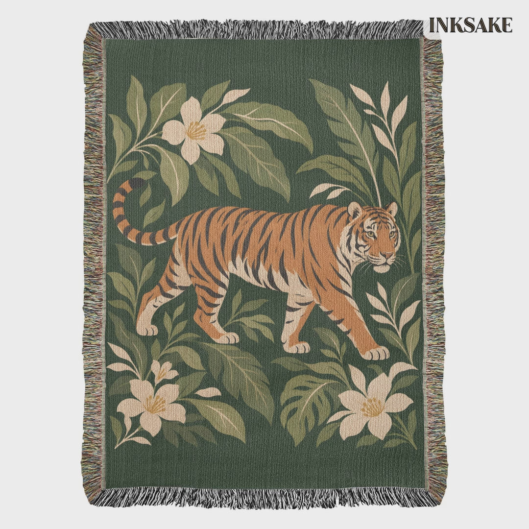 Tiger Botanical woven cotton blanket video: the full front on white, then hung on an outdoor line among trees with a slow zoom on the striding tiger.